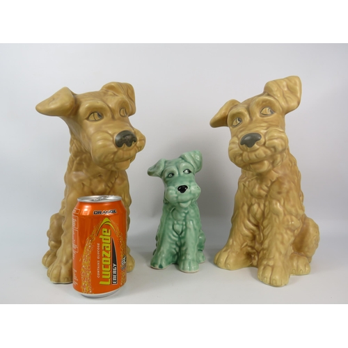 73 - Two large beige Sylvac terrier dogs model no 1380 plus a smaller green dog model 1379.