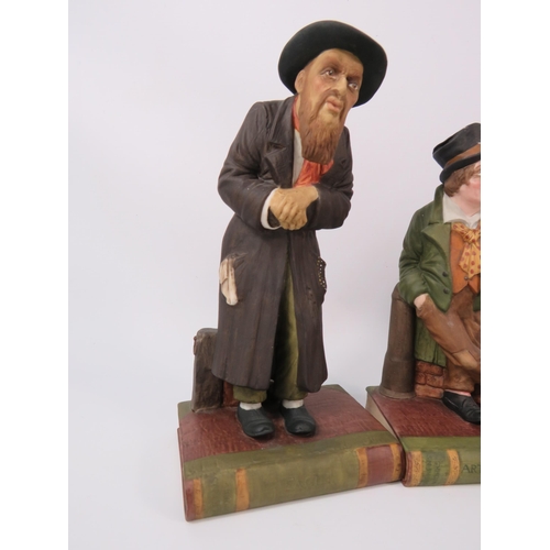 106 - Three Aynsley Oliver Twist figurines and a Mr McCawber, 9.5