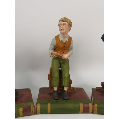 106 - Three Aynsley Oliver Twist figurines and a Mr McCawber, 9.5