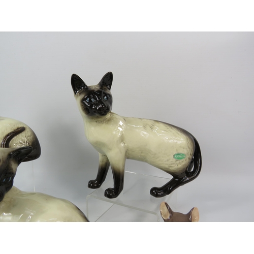 109 - Beswick Siamese cat figurines including one on a ceramic plaque with a mouse called 