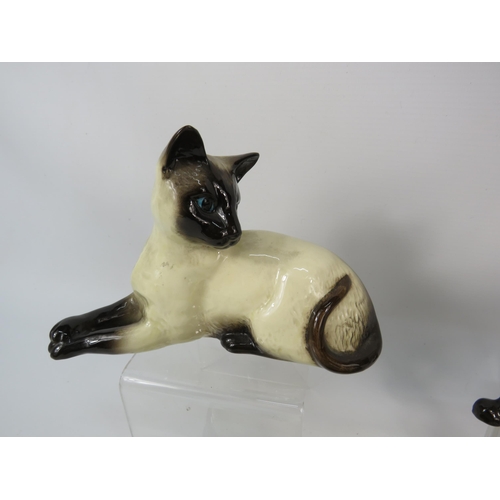 109 - Beswick Siamese cat figurines including one on a ceramic plaque with a mouse called 