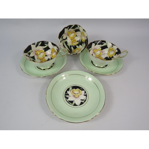 117 - Three Paragon china Daffodil bowl cups and saucers.