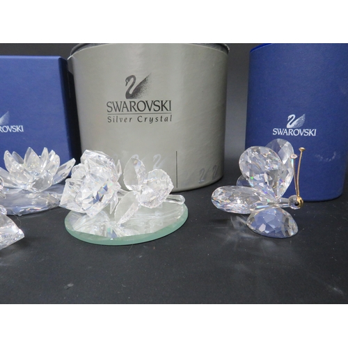 124 - Five Swarovski crystal glass figurines some with boxes.