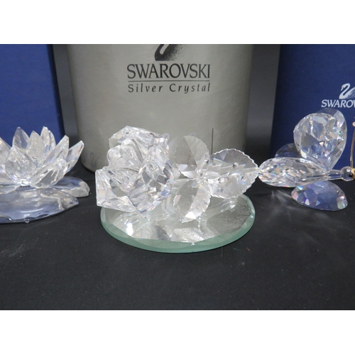 124 - Five Swarovski crystal glass figurines some with boxes.