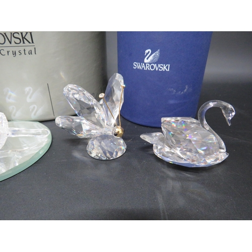 124 - Five Swarovski crystal glass figurines some with boxes.