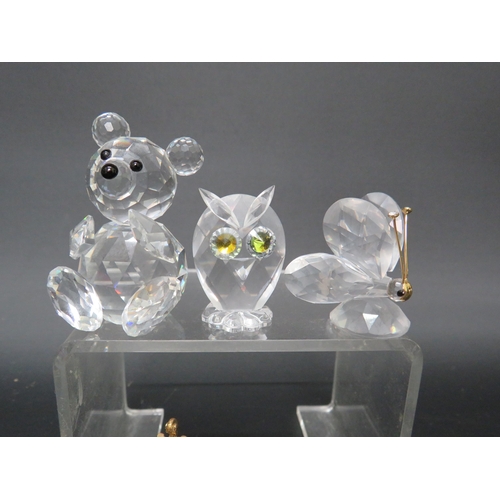 136 - Eight small Swarovski glass figurines.