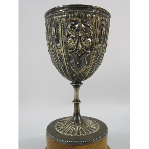 153 - Vintage silver plated Trophy with embossed detail standing on a wooden base, 8.5