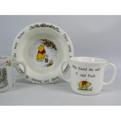 159 - Wedgwood and Royal Doulton Bowl and Cup Nursery sets, Peter Rabbit and Winnie the Pooh.