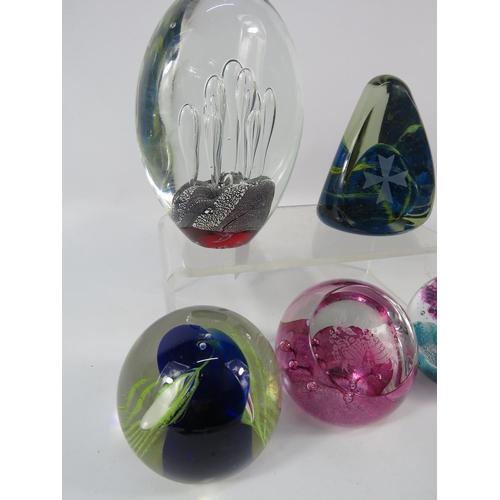 167 - Five art glass paperweights including some by Caithness and Mdina.