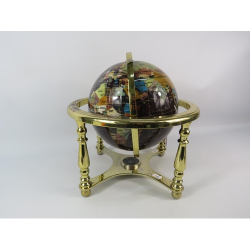 191 - Semi precious stone world globe in a gold could coloured stand (pitting to the gold) 13.5