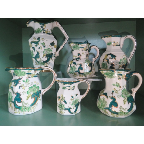 246 - Six Masons Ironstone jugs in the Green Chartruese pattern.