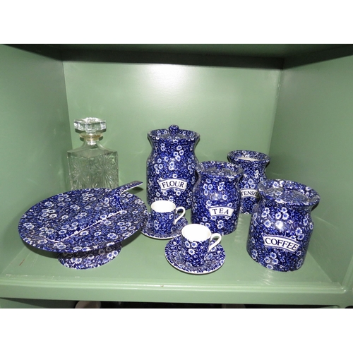 267 - 29 Pieces of Burleigh Calico ceramics, Storage jars, Cake stand and slice, cups etc.