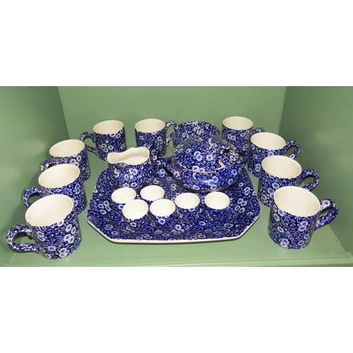 267 - 29 Pieces of Burleigh Calico ceramics, Storage jars, Cake stand and slice, cups etc.