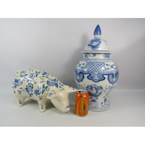 269 - Large blue and white transfer print pig money box and a lidded oriental jar which is 18