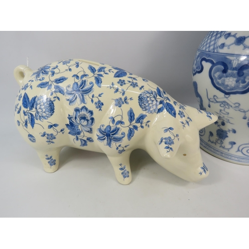 269 - Large blue and white transfer print pig money box and a lidded oriental jar which is 18