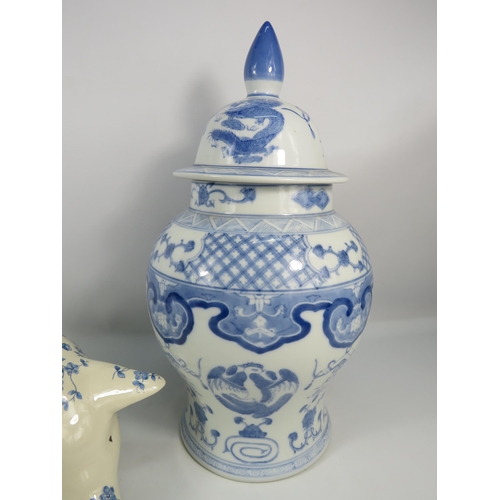 269 - Large blue and white transfer print pig money box and a lidded oriental jar which is 18