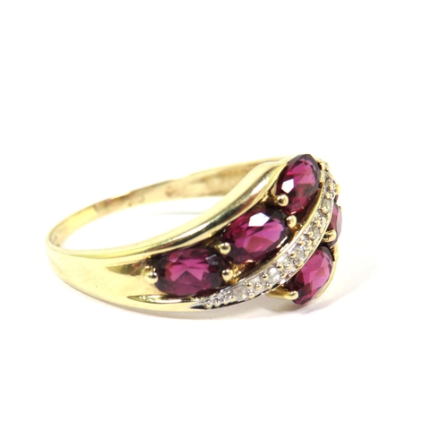 301 - 9ct Yellow Gold Ring set with six Rhodalites with a band of Diamond Chips. Finger size 'Q'  2.4g