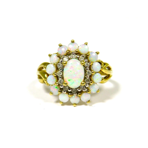 304 - 9ct Yellow Gold Ring Set with a Central Opal with Diamond and Opal Surround.  Fingers size 'O-5'   3... 