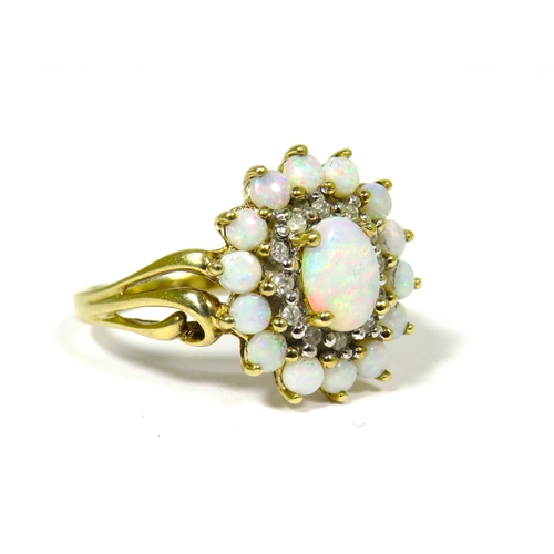 304 - 9ct Yellow Gold Ring Set with a Central Opal with Diamond and Opal Surround.  Fingers size 'O-5'   3... 