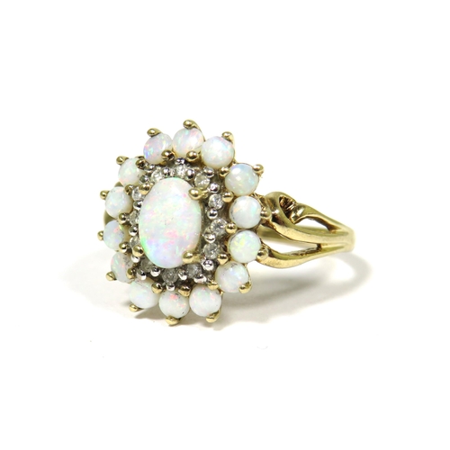 304 - 9ct Yellow Gold Ring Set with a Central Opal with Diamond and Opal Surround.  Fingers size 'O-5'   3... 