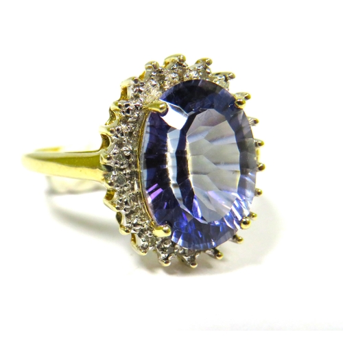 306 - 9ct Yellow Gold Ring set with a Large Central Tanzanite (14 x 9mm) with Diamond Surround.  Finger si... 