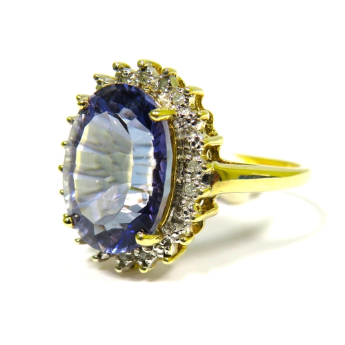 306 - 9ct Yellow Gold Ring set with a Large Central Tanzanite (14 x 9mm) with Diamond Surround.  Finger si... 