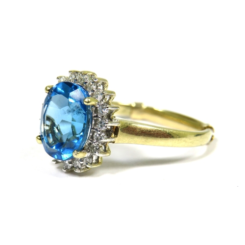 310 - 9ct Yellow Gold Ring set with a large Central Topaz (10x 8mm) Diamond Surround. Finger Size 'R'  3.5... 