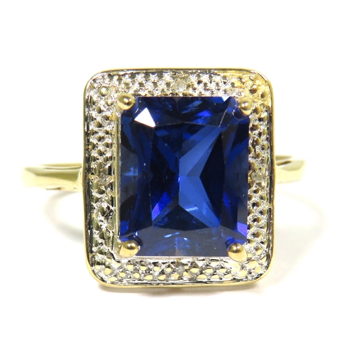 311 - 9ct Yellow Gold Ring set with a Blue Central Sapphire (10 x 8mm) with Diamond Chip Surround.  Finger... 