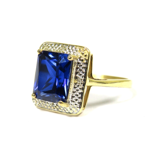 311 - 9ct Yellow Gold Ring set with a Blue Central Sapphire (10 x 8mm) with Diamond Chip Surround.  Finger... 