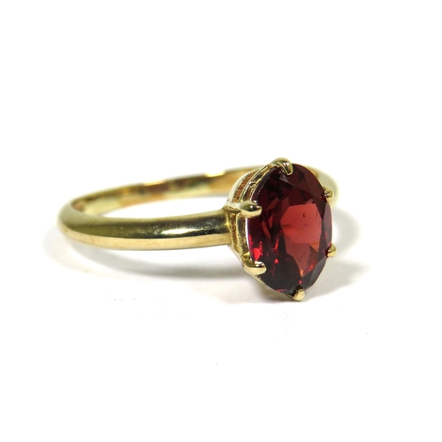 312 - 9ct Yellow Gold Ring set with an Oval Central Garnet (8 x 6mm)  Finger size 'M-5'   1.7g