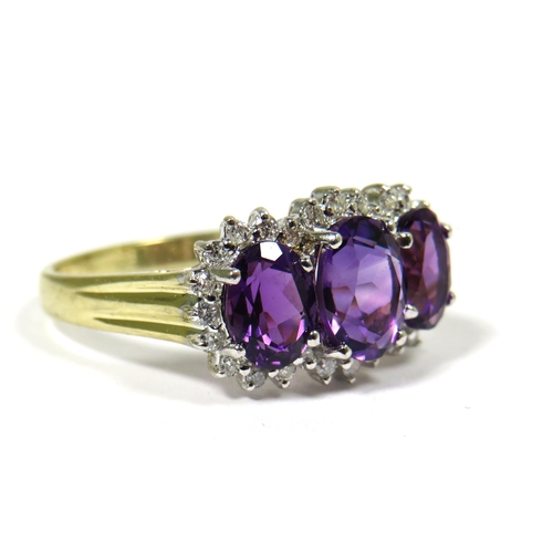 321 - 9ct Yellow Gold Ring set with Triple Amethysts with Diamond Surrounds.  Finger size 'S'   2.4g