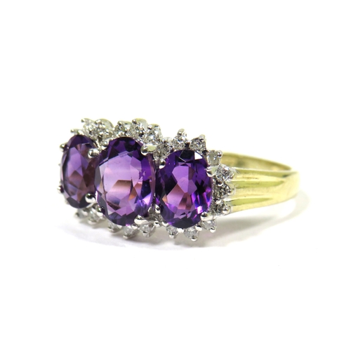 321 - 9ct Yellow Gold Ring set with Triple Amethysts with Diamond Surrounds.  Finger size 'S'   2.4g