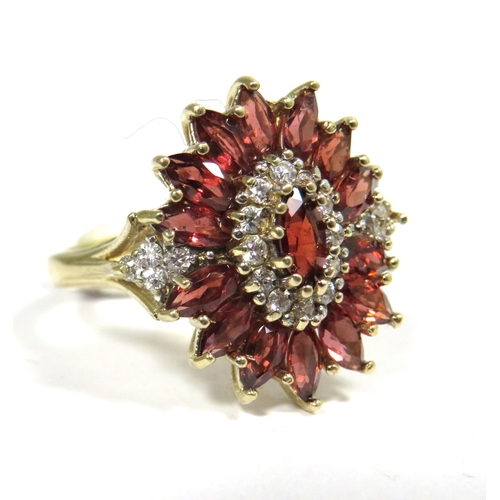 324 - 9ct Yellow Gold Ring set with a Central Garnet with Diamond Surround and sides.  Finger size 'M'   5... 