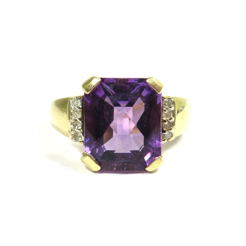 326 - 9ct Yellow Gold Ring set with a large Central cushion cut Amethyst which measures 12 x 10 mm with Di... 