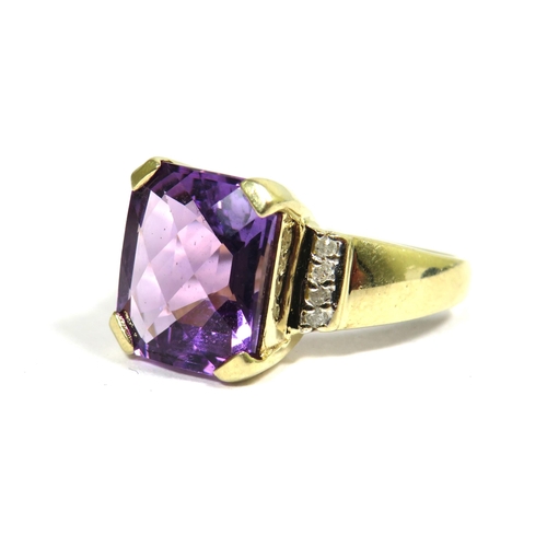 326 - 9ct Yellow Gold Ring set with a large Central cushion cut Amethyst which measures 12 x 10 mm with Di... 