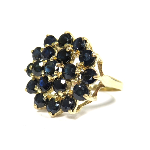 327 - 9ct Yellow Gold Ring set with Multiple 3mm Sapphires in a Flower pattern.  Finger size 'O'   4.8g