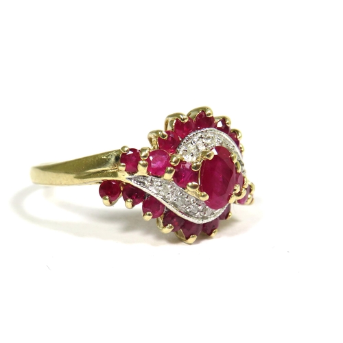 328 - 9ct Yellow Gold Ring set with Rubies and Diamonds in a Swirl pattern.  Finger size 'O'   3.4g