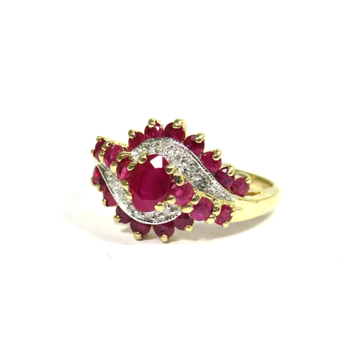 328 - 9ct Yellow Gold Ring set with Rubies and Diamonds in a Swirl pattern.  Finger size 'O'   3.4g