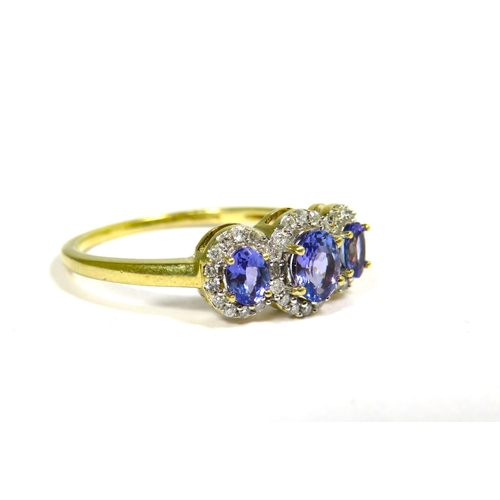 332 - 9ct Yellow Gold Ring set with a trio of Tanzanite Coloured Gemstones with CZ Surround. Finger size '... 