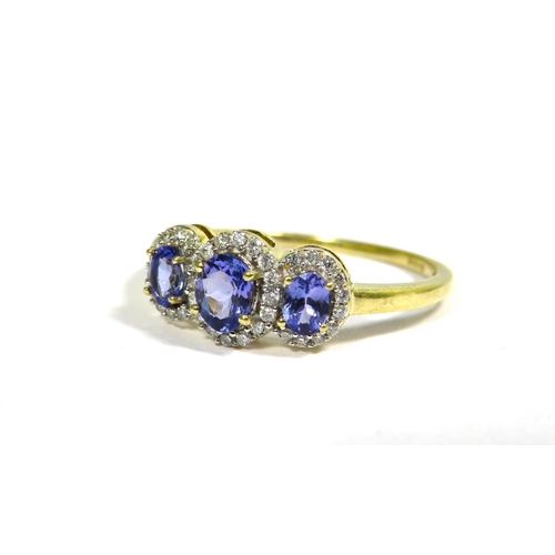 332 - 9ct Yellow Gold Ring set with a trio of Tanzanite Coloured Gemstones with CZ Surround. Finger size '... 