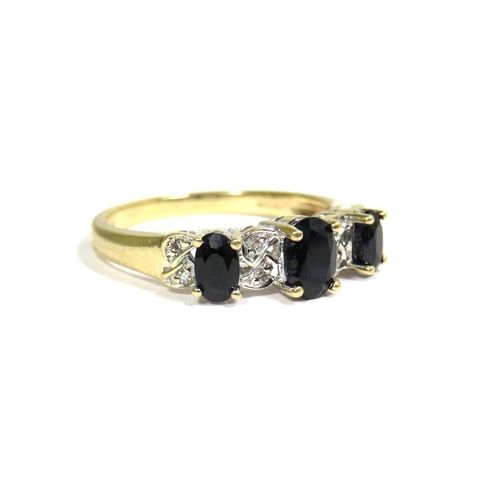 335 - 9ct Yellow Gold Ring set with a Trio of Sapphires (6 x 4mm & 4 x 3mm) Surrounded by Small Diamonds. ... 