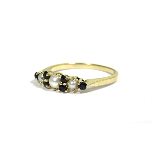 336 - 9ct Yellow Gold Ring set with Six small Sapphires and Three Seed Pearls.   Finger size 'N'   1.6g