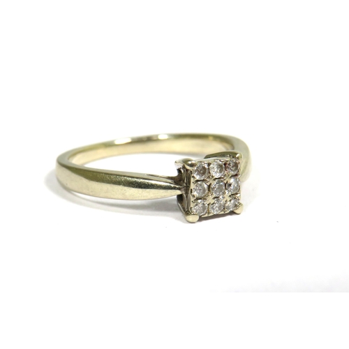 338 - 18ct White Gold Ring set with 9 Square cut Diamonds.  Finger size 'K'  3.0g