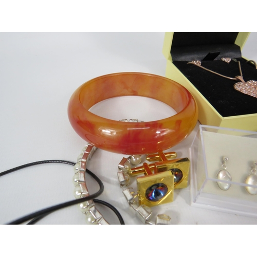 299 - Mixed costume jewellery including a bakelite bangle, cherry bead necklaces and some sterling silver ... 