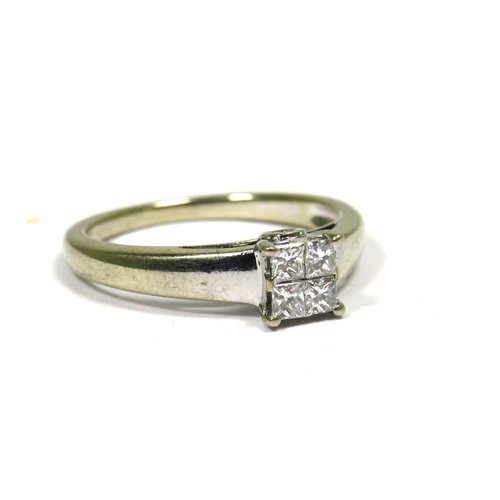 352 - 18ct White Gold Ring set with Four Square Cut Diamonds. Finger size 'I-5'  2.5g