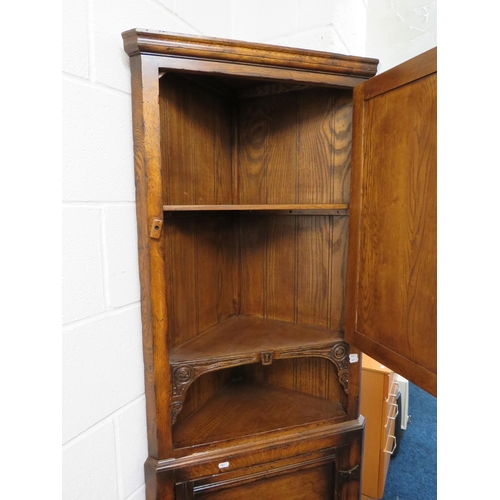 1041 - Oak Corner Cabinet in the old charm style. Comes in two pieces.  H:70 inches tall. See photos.