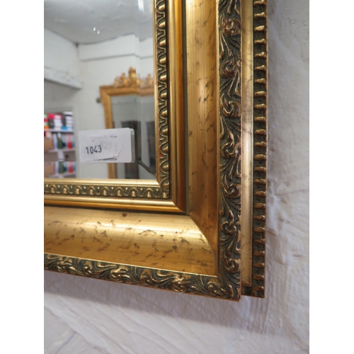 1043 - Large Bevelled Edged mirror in gilt frame. 35 x 46 inches. See photos.