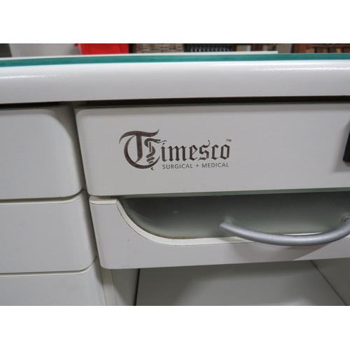 1062 - Timesco Medical Cabinet with light and steriliser together with sit on drawer unit. See photos.