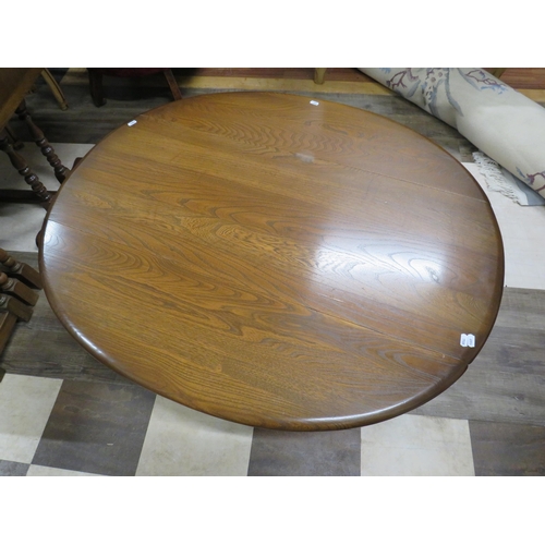 1070 - Ercol Drop Leaf Coffee Table of good colour in good conditon H:19 x W:42 .  See photos.