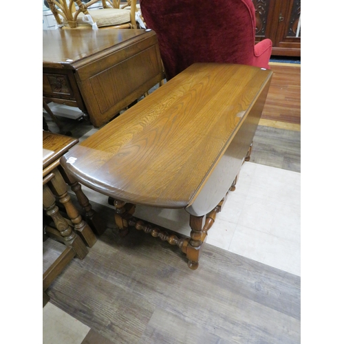 1070 - Ercol Drop Leaf Coffee Table of good colour in good conditon H:19 x W:42 .  See photos.